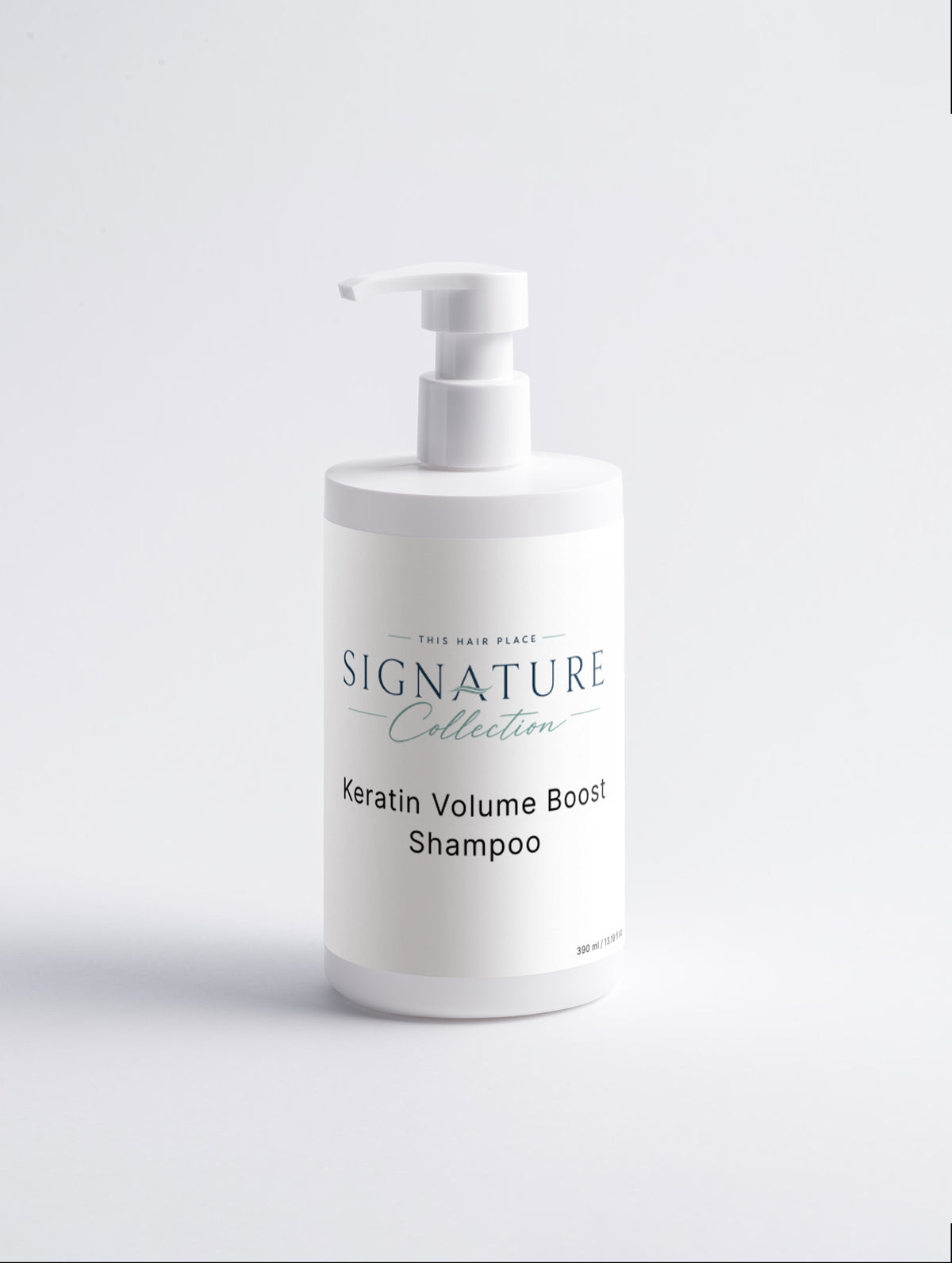 White shampoo bottle with pump labeled 'Signature Collection Sensitive Scalp Shampoo' on a light gray background