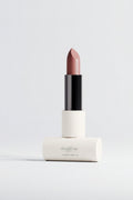 Lipstick with black cap and beige body on a white background