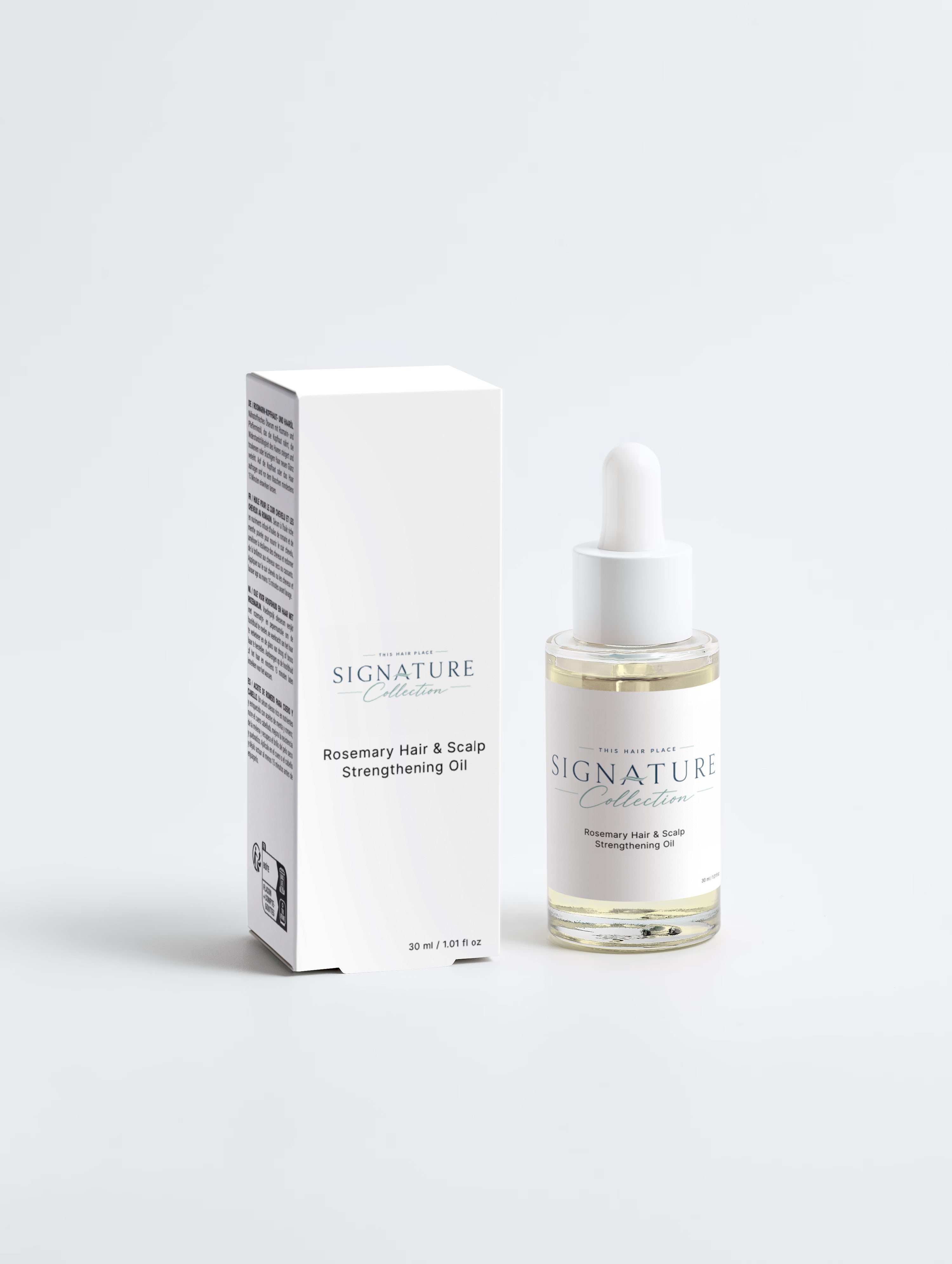 Signature Rosemary Hair & Scalp Strengthening Oil bottle and packaging on a white background